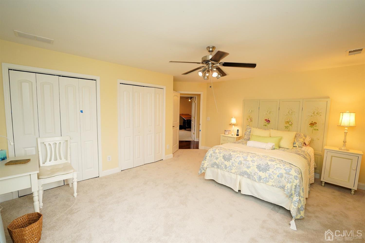 56 Kingsley Road Kendall Park, NJ 08824 - Photo 49 of 62 a bedroom with a bed and a chandelier