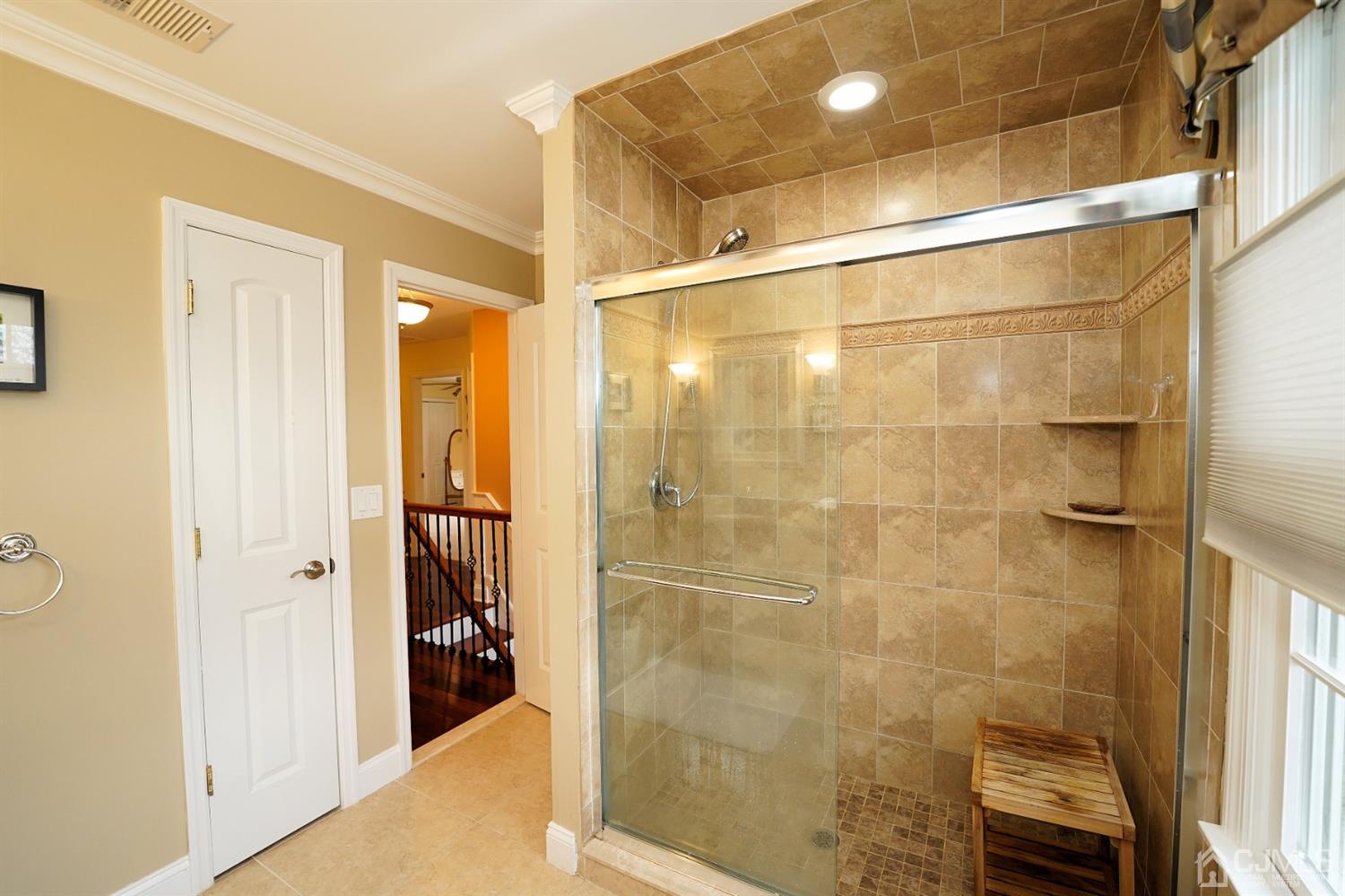 56 Kingsley Road Kendall Park, NJ 08824 - Photo 56 of 62 a bathroom with a shower and a sink