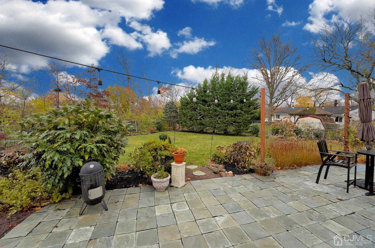 56 Kingsley Road Kendall Park, NJ 08824 - Photo 57 of 62 a view of a backyard with sitting area