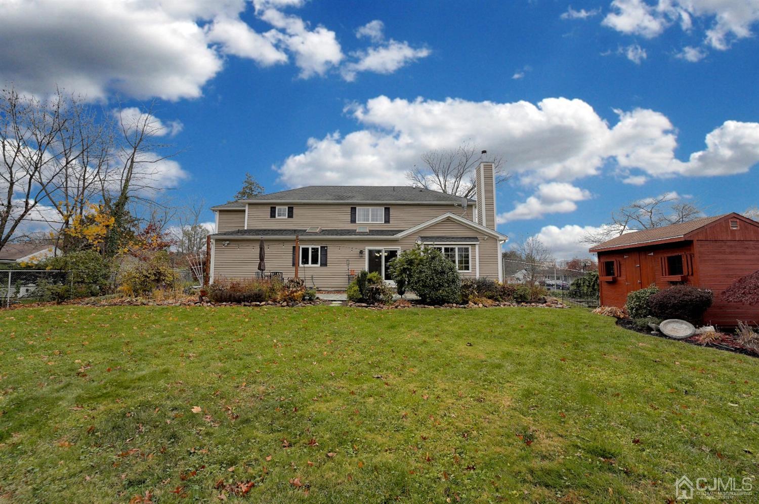 56 Kingsley Road Kendall Park, NJ 08824 - Photo 59 of 62 a view of a house with a big yard