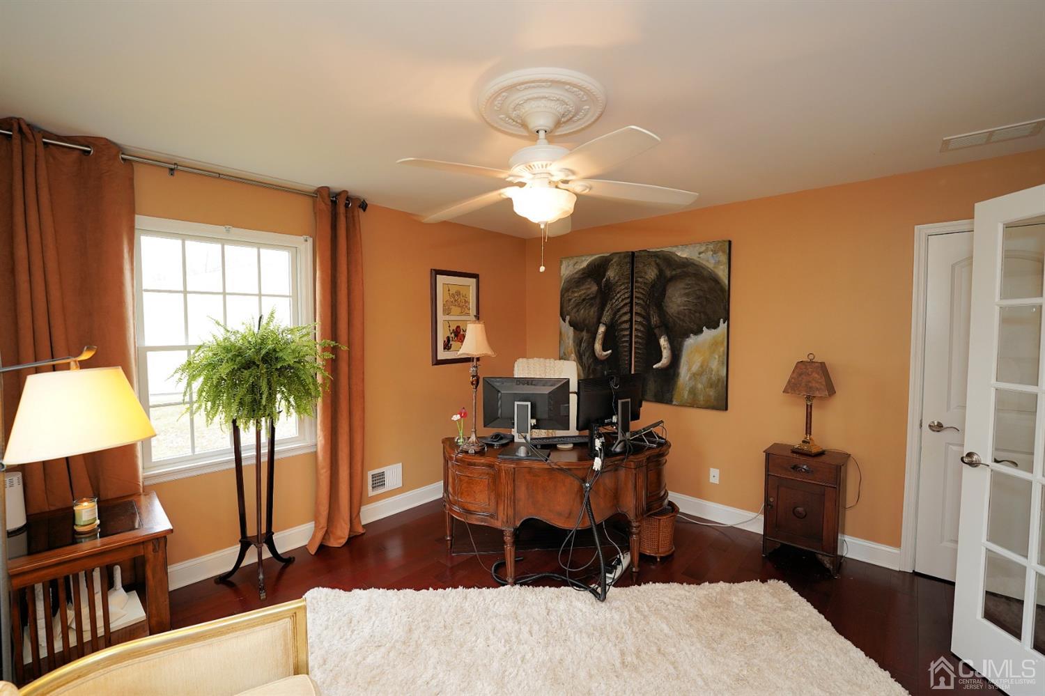 56 Kingsley Road Kendall Park, NJ 08824 - Photo 9 of 62 a living room with furniture a chandelier and a window