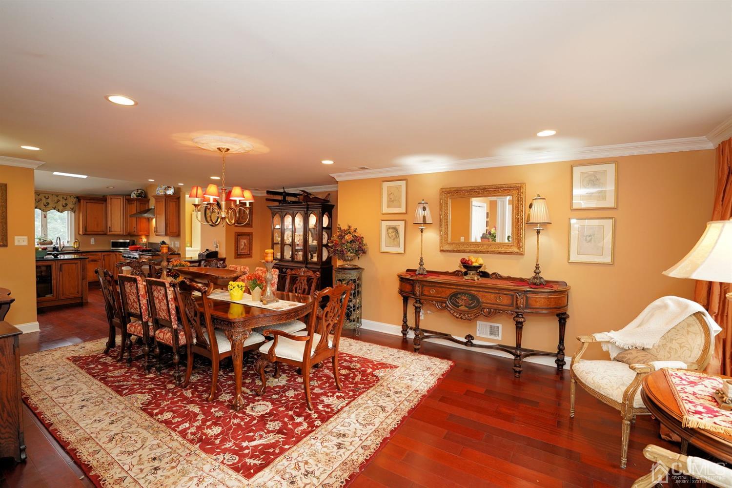56 Kingsley Road Kendall Park, NJ 08824 - Photo 10 of 62 a living room with lots of furniture and a rug