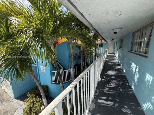 a view of stairs and potted plants