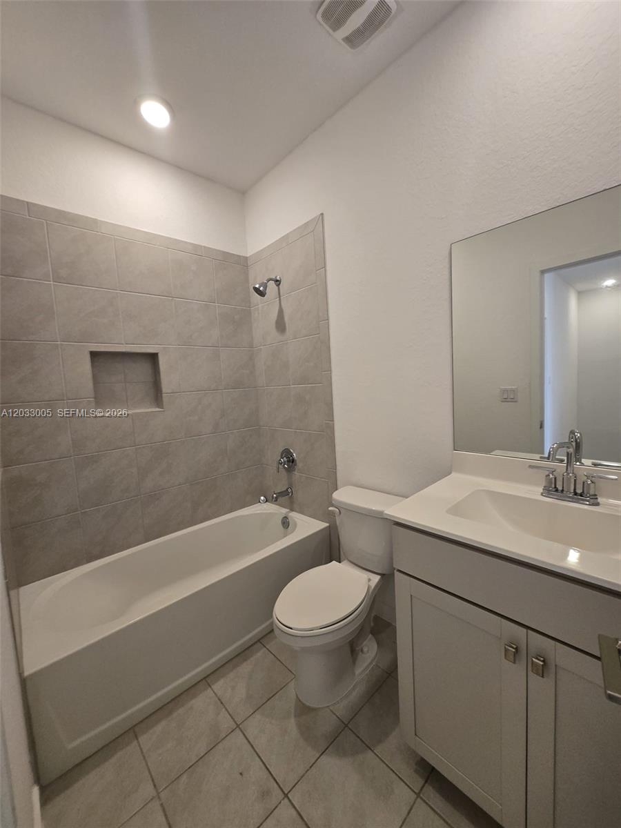 862 Southeast 17 Street, Unit 862 Homestead, FL 33034 - Photo 18 of 39 a bathroom with a sink a toilet and a bathtub