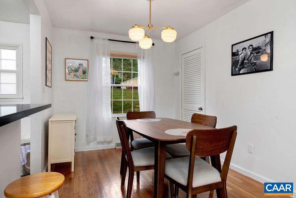 114 Hessian Hills Ridge, Unit 1 Charlottesville, VA 22901 - Photo 6 of 20 a view of a dining room with furniture and wooden floor