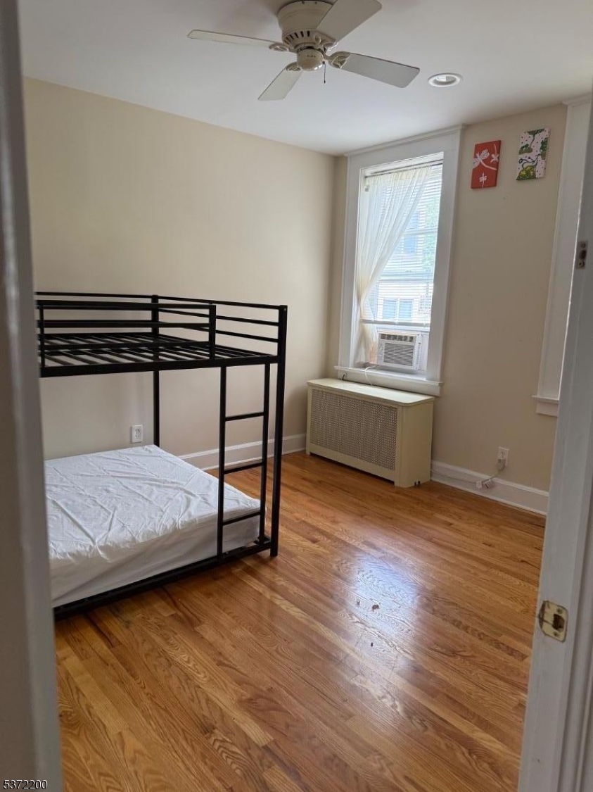 22 Baldwin Street, Unit 1 Montclair, NJ 07042 - Photo 12 of 22 a bedroom with furniture and a window