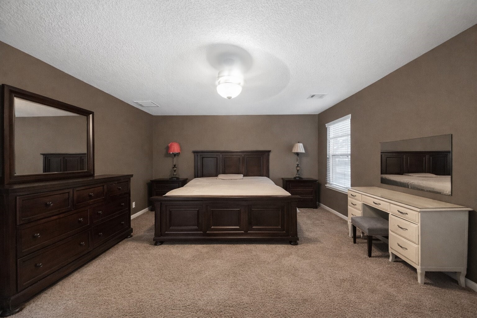 7902 Sesame Street Baytown, TX 77521 - Photo 9 of 24 a bedroom with a bed and a flat screen tv