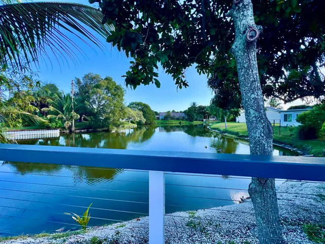 a view of balcony with wooden floor and outdoor seating