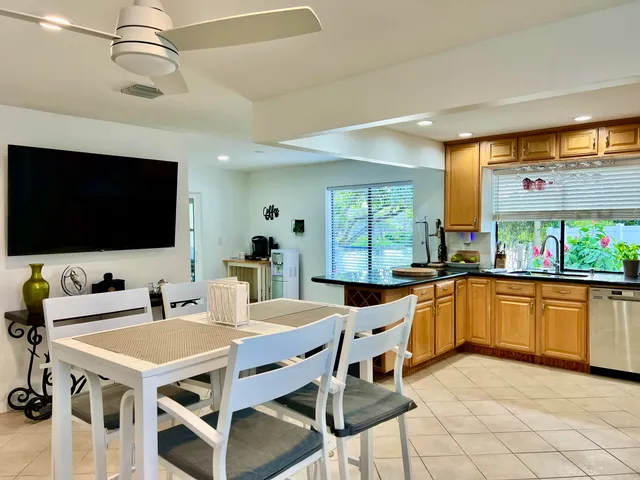 a kitchen with stainless steel appliances and a refrigerator