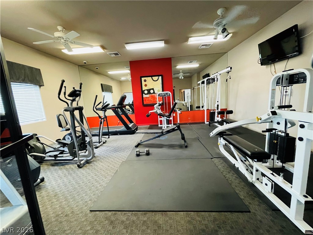 7701 West Robindale Road, Unit 206 Las Vegas, NV 89113 - Photo 26 of 30 Mirrored walls and durable commercial flooring create an ideal environment for daily workouts.