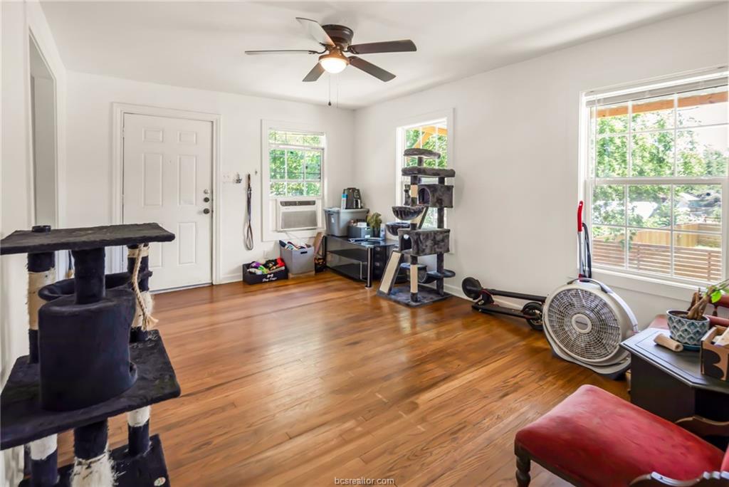 1300 Antone Street, Unit B Bryan, TX 77803 - Photo 2 of 7 a room with furniture and wooden floor