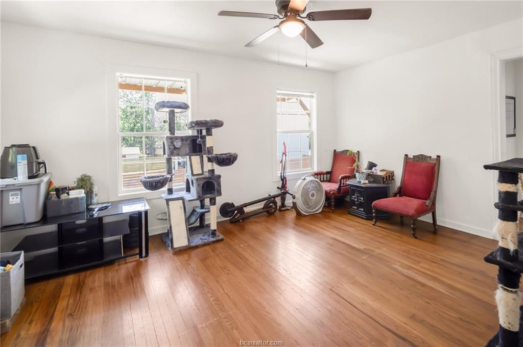 1300 Antone Street, Unit B Bryan, TX 77803 - Photo 3 of 7 a living room with furniture and a wooden floor