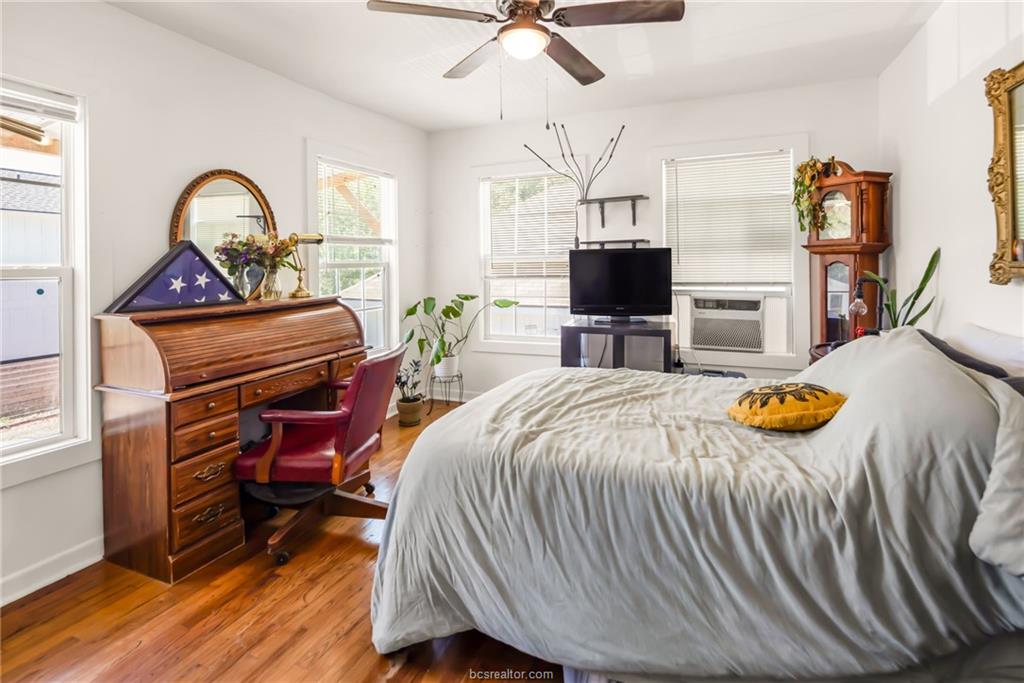 1300 Antone Street, Unit B Bryan, TX 77803 - Photo 7 of 7 a bedroom with a bed and a chandelier