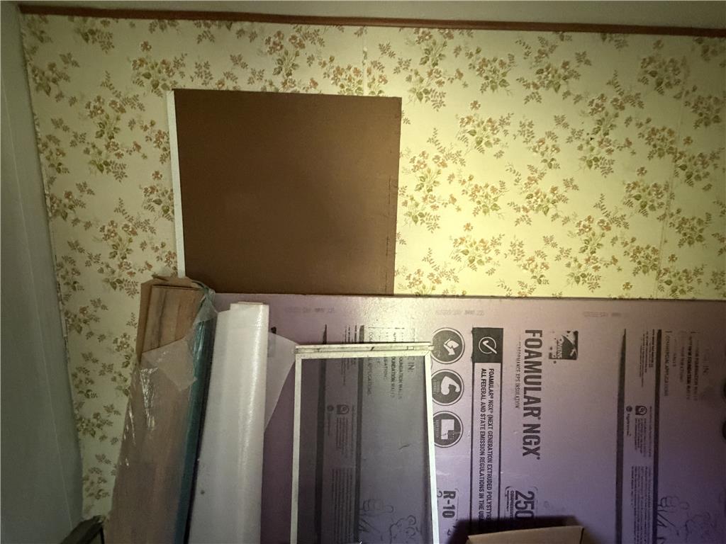 5114 Three Lakes Road New Milford, PA 18834 - Photo 26 of 55 Vintage patterned wallpaper defines the walls in this interior space awaiting updates.