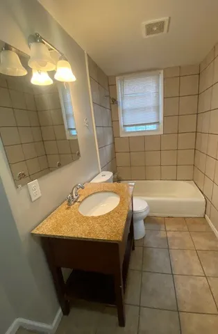 a bathroom with a sink and a bathtub