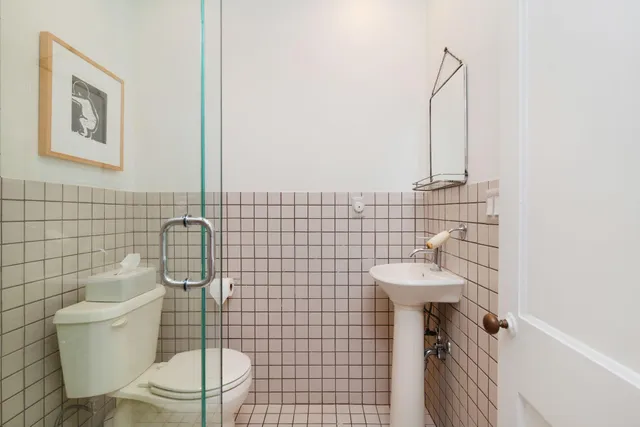 a bathroom with a toilet and a sink