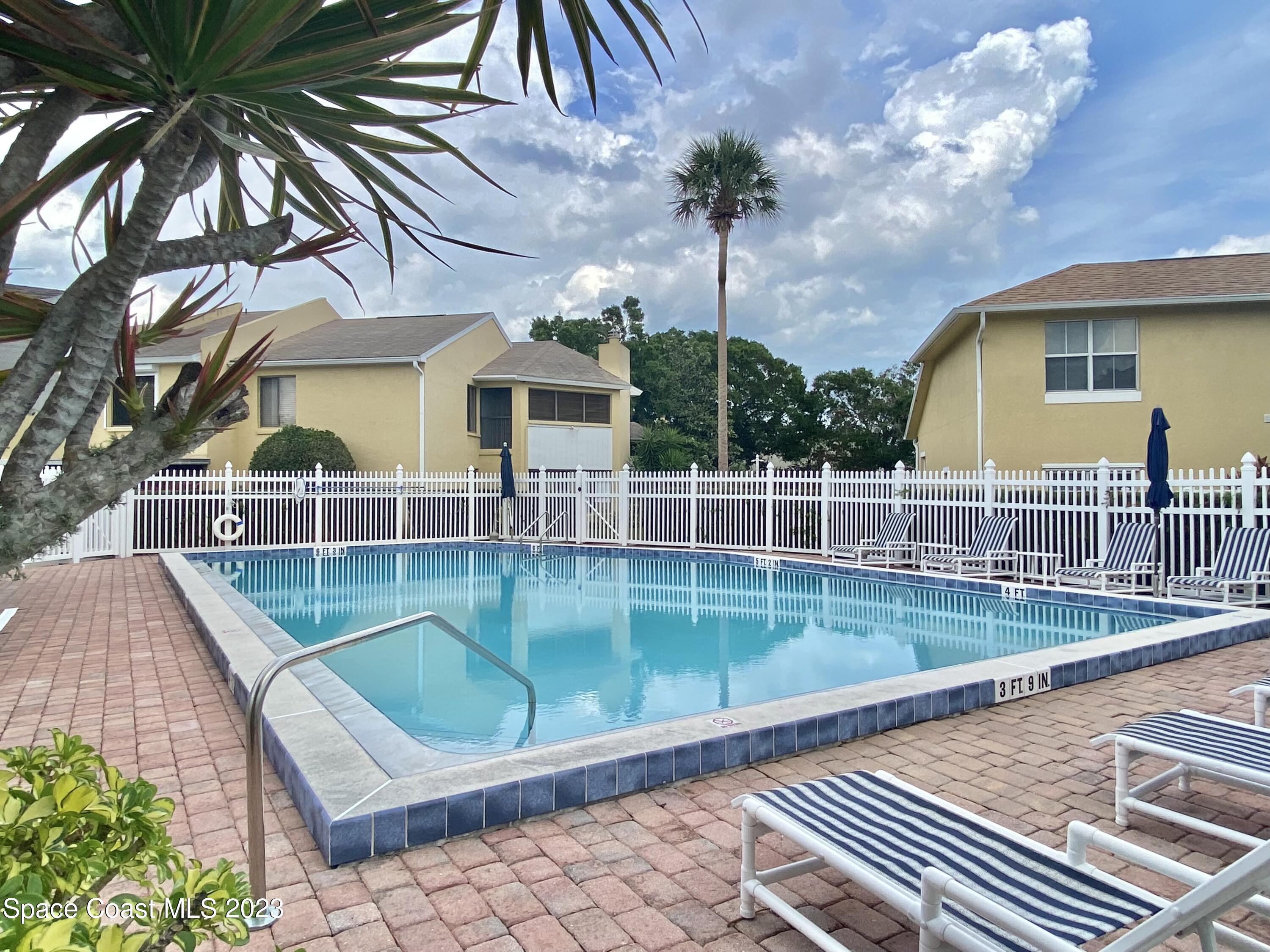 664 Cedar Side Circle Northeast Palm Bay, FL 32905 - Photo 19 of 20 a view of a house with a backyard