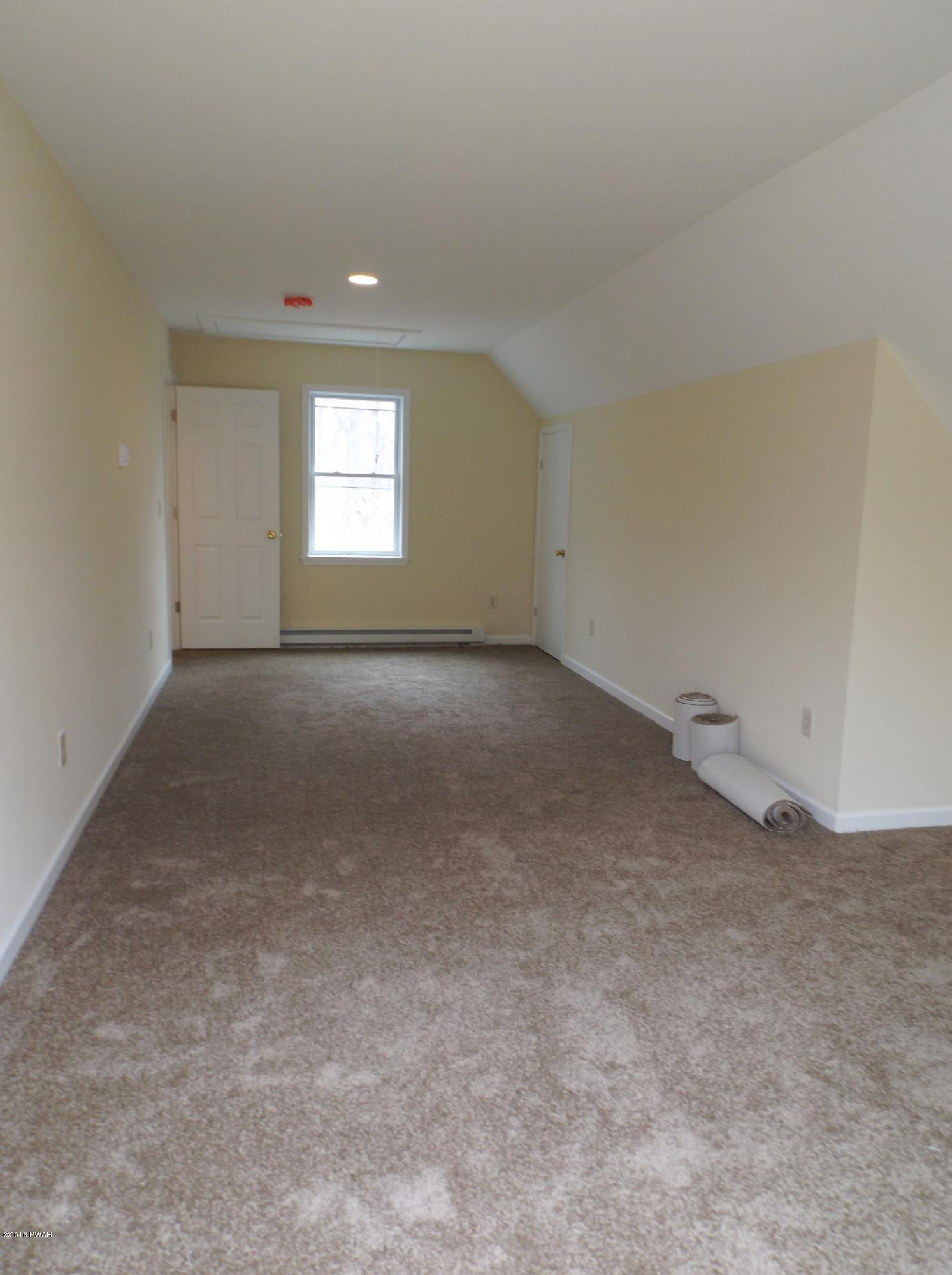 109 Keystone Court Dingmans Ferry, PA 18328 - Photo 8 of 18 a view of an empty room with a window