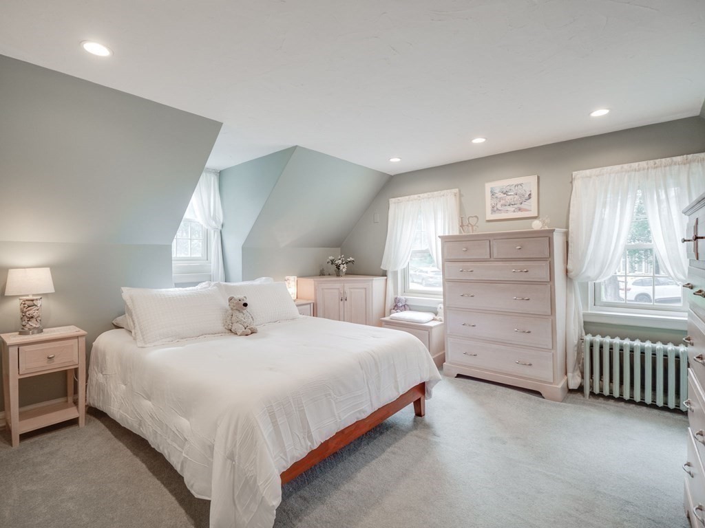 35 Pine Street Melrose, MA 02176 - Photo 21 of 38 a bedroom with a bed and a window