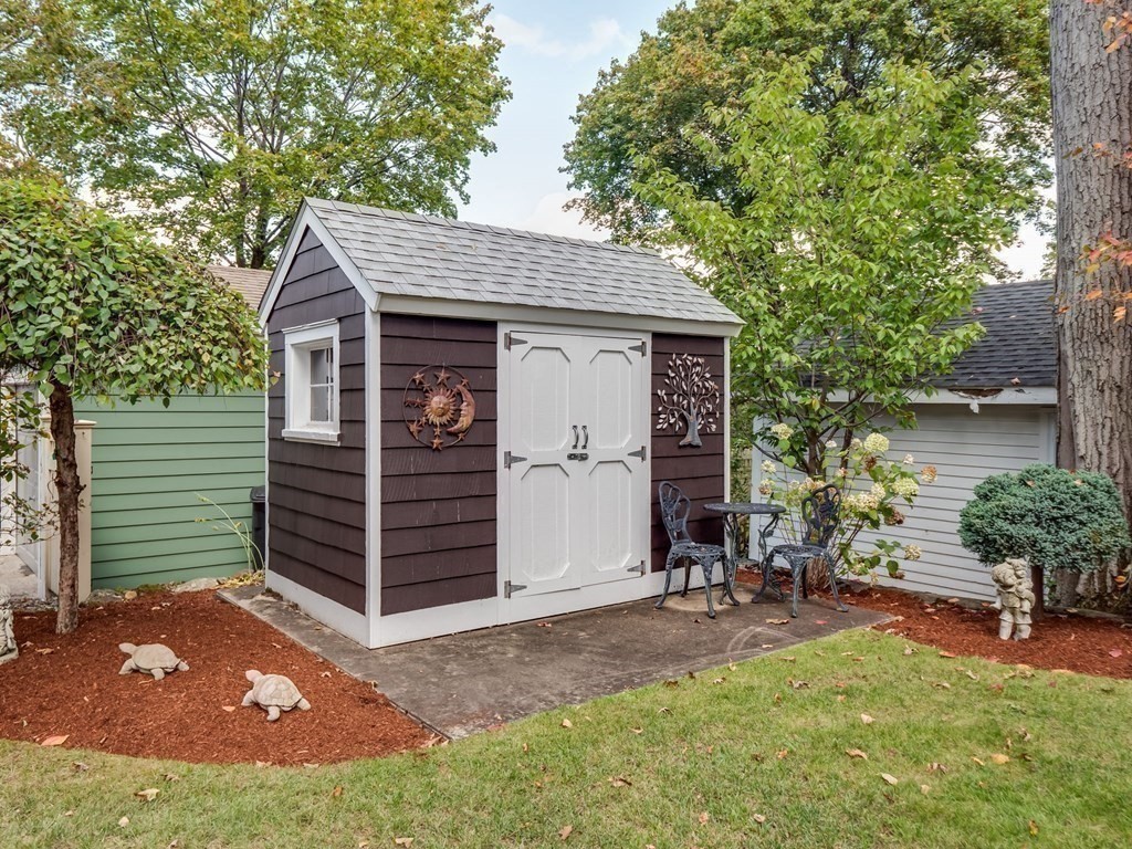 35 Pine Street Melrose, MA 02176 - Photo 32 of 38 a view of a small house with a garage