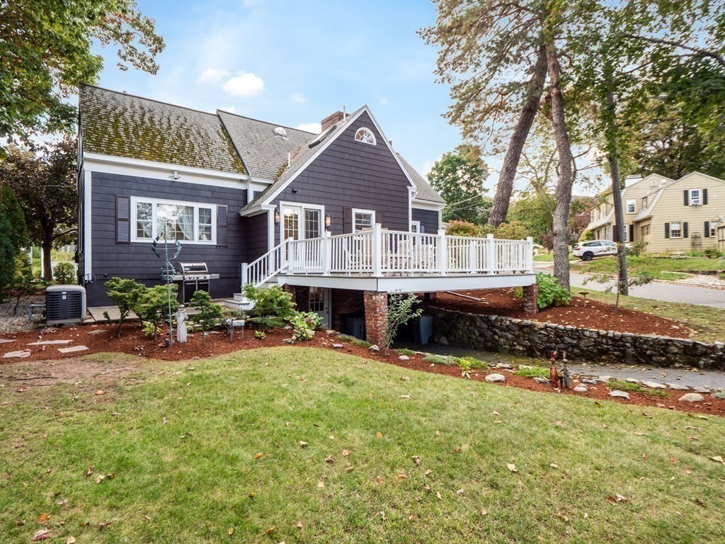 35 Pine Street Melrose, MA 02176 - Photo 33 of 38 a view of a house with a yard and sitting area