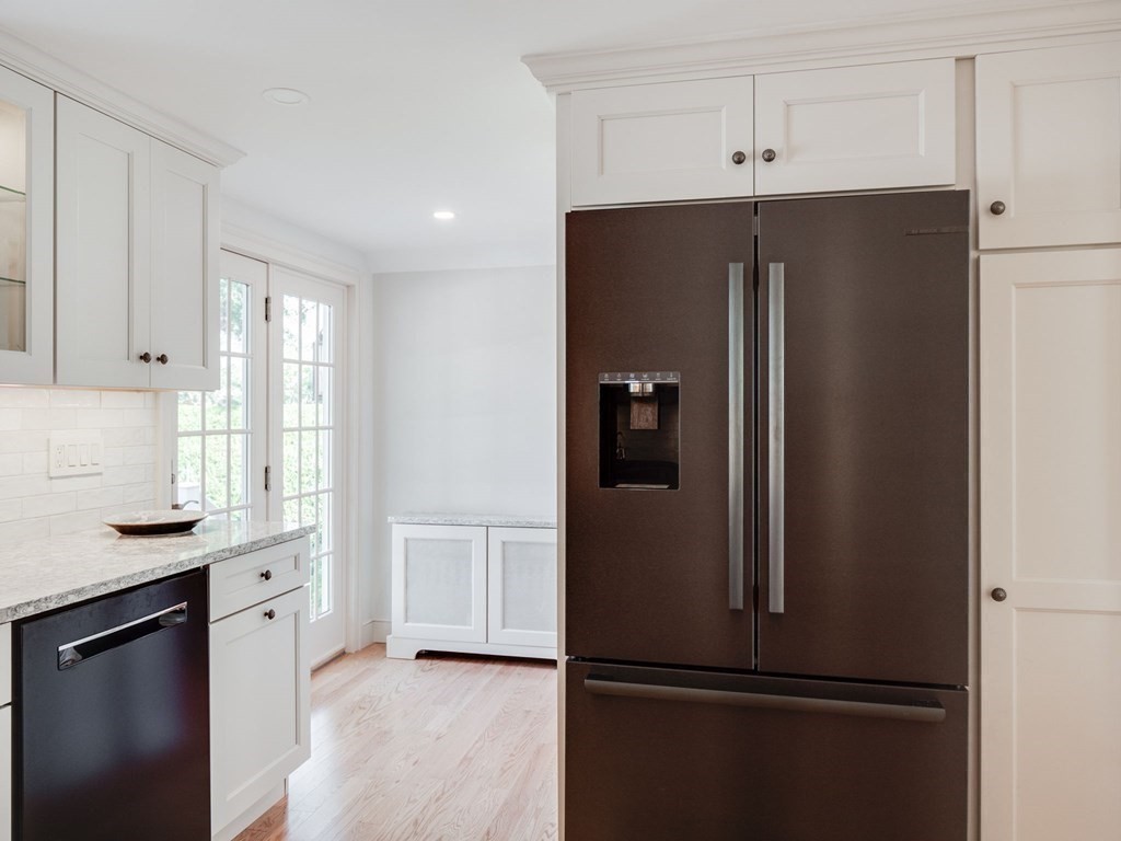 35 Pine Street Melrose, MA 02176 - Photo 5 of 38 a kitchen with a refrigerator and a sink