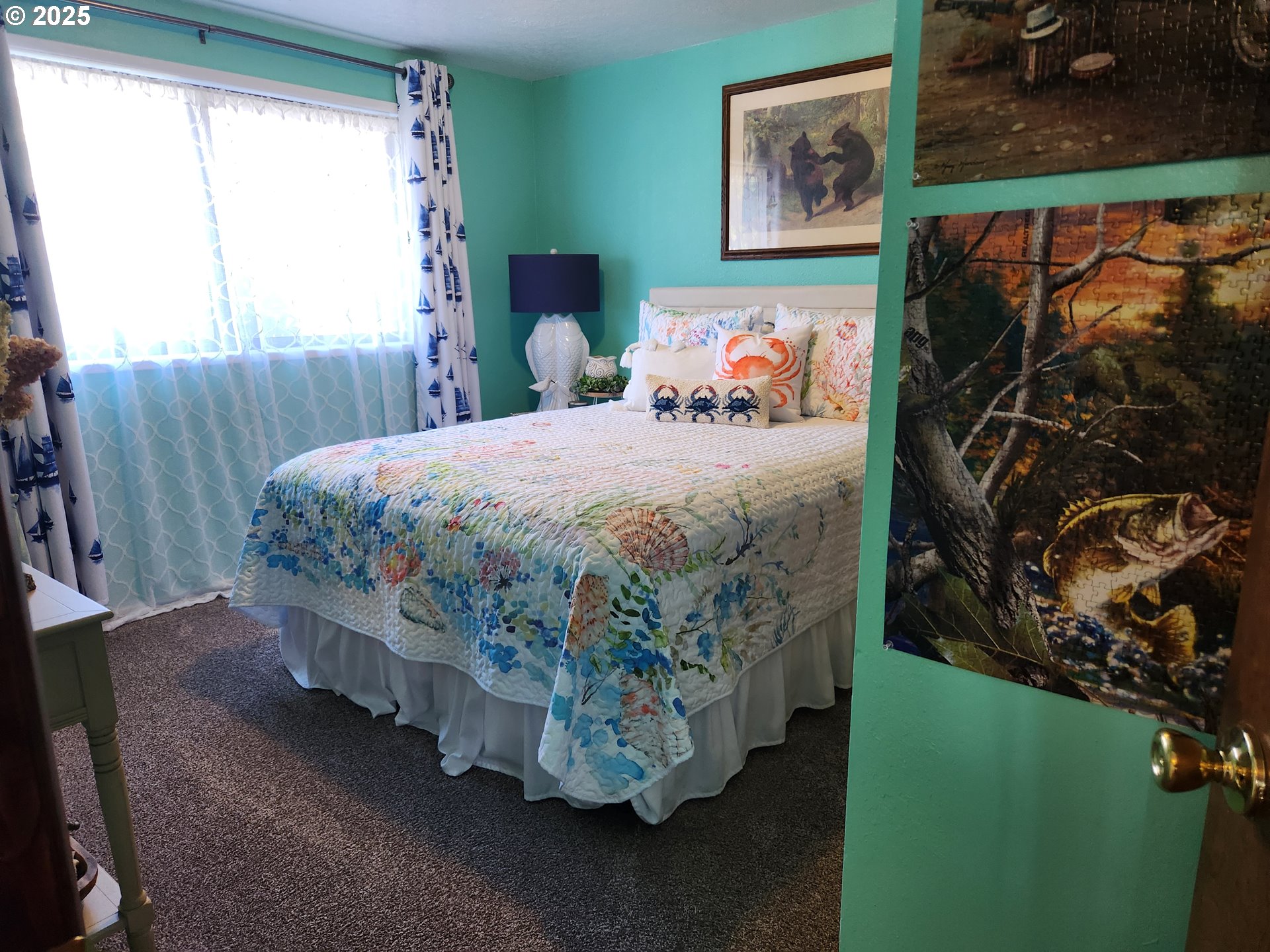 1144 Winchester Avenue Reedsport, OR 97467 - Photo 23 of 47 a bed sitting in a bedroom next to a window