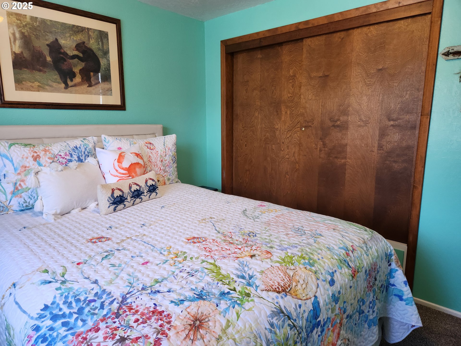 1144 Winchester Avenue Reedsport, OR 97467 - Photo 25 of 47 a bedroom with a bed and painting on the wall