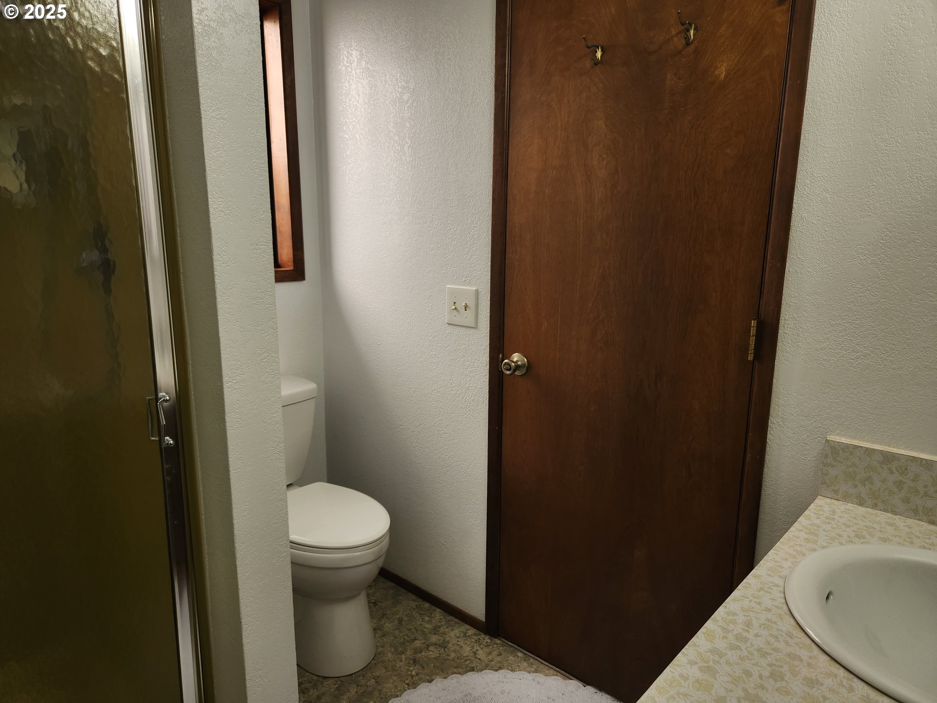 1144 Winchester Avenue Reedsport, OR 97467 - Photo 30 of 47 a bathroom with a granite countertop toilet and a sink