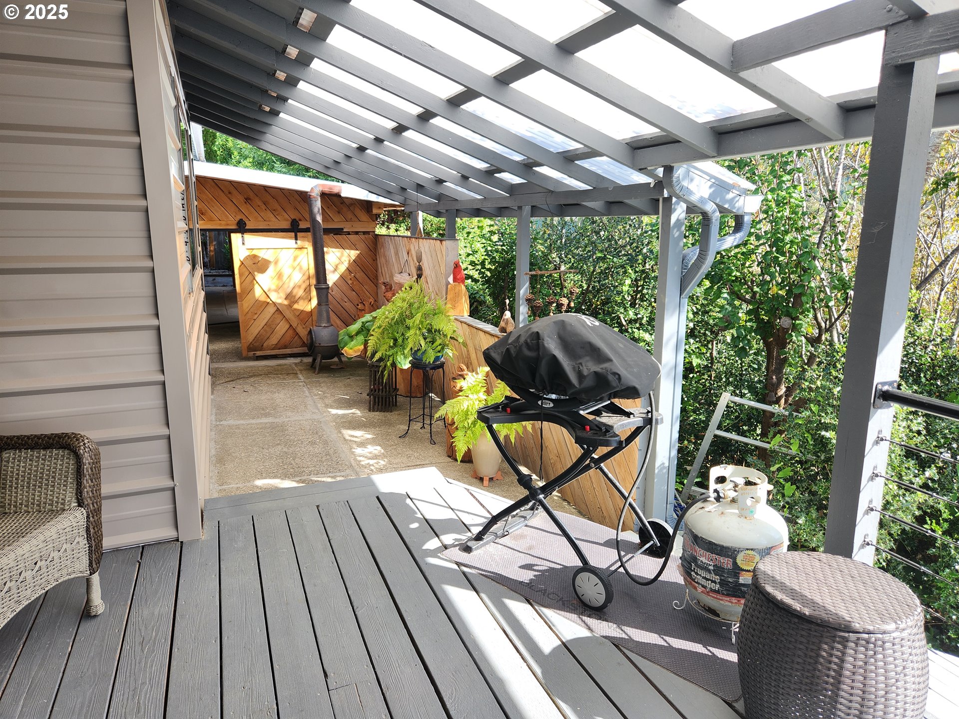 1144 Winchester Avenue Reedsport, OR 97467 - Photo 35 of 47 a view of a porch with furniture and wooden floor