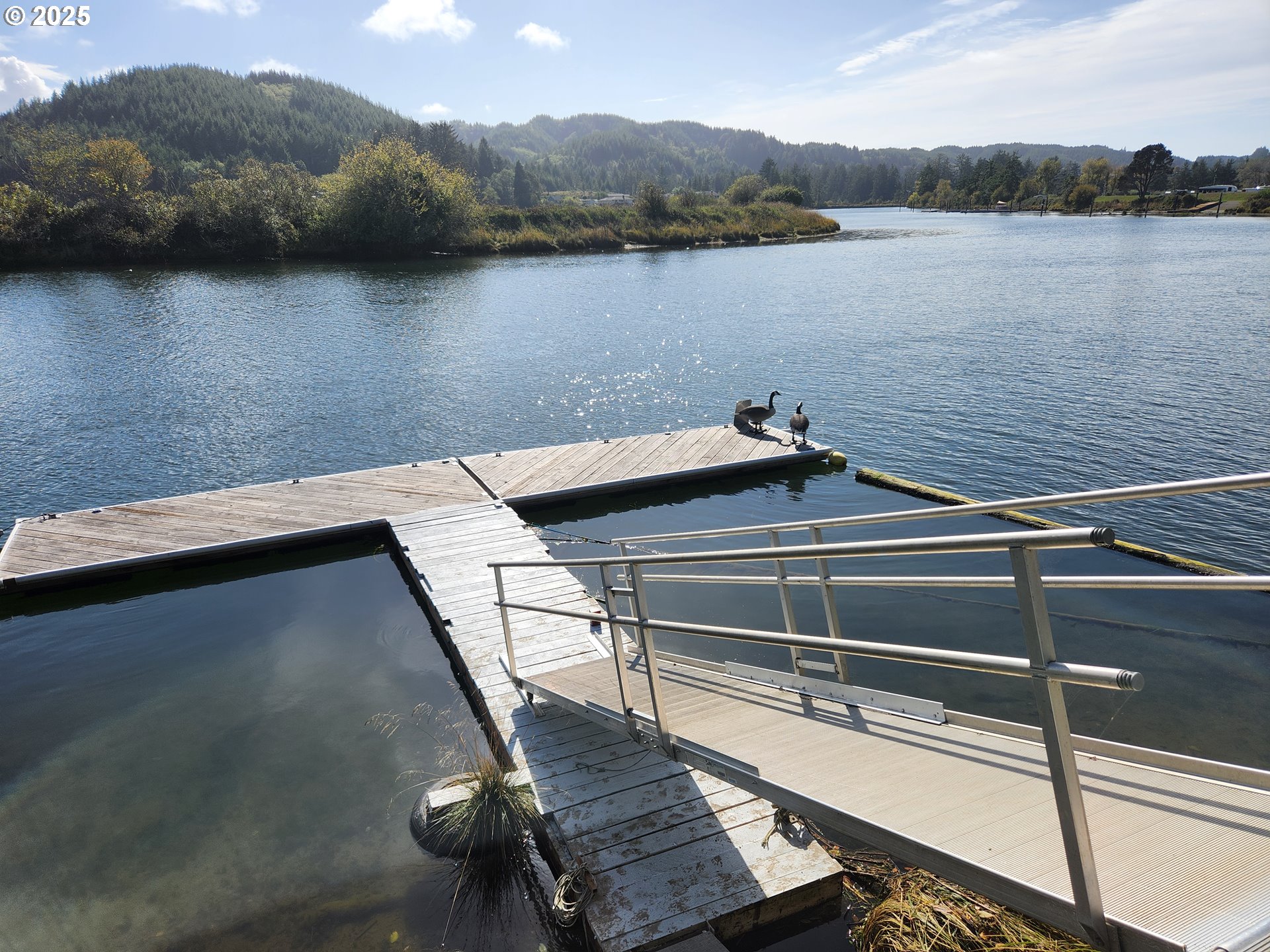 1144 Winchester Avenue Reedsport, OR 97467 - Photo 36 of 47 a view of a lake with a mountain