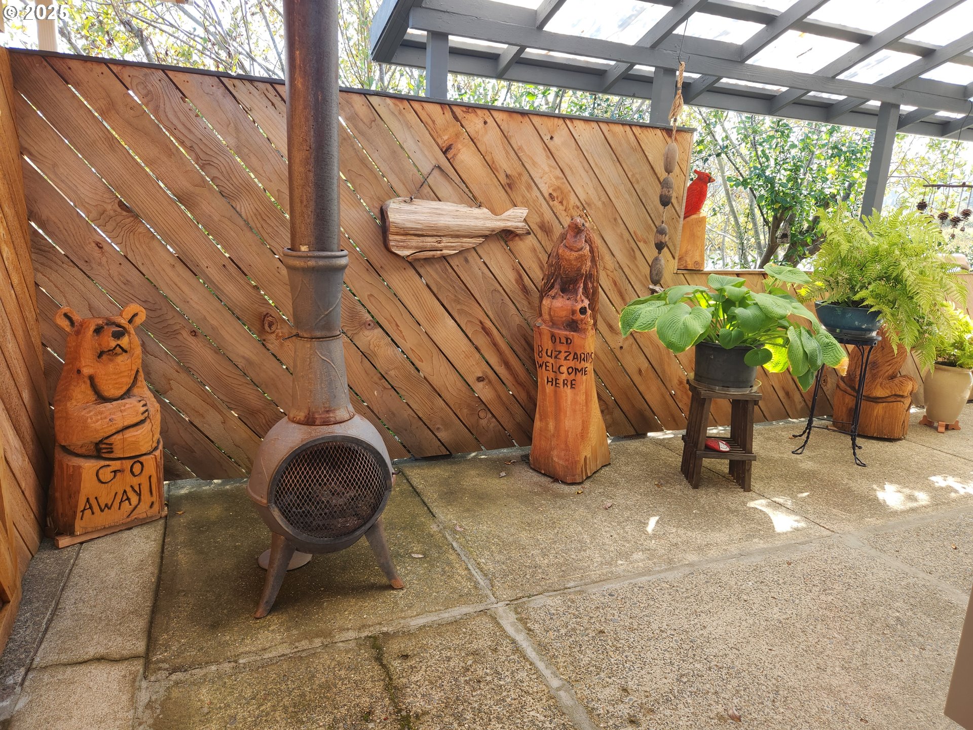 1144 Winchester Avenue Reedsport, OR 97467 - Photo 37 of 47 a backyard of a house with barbeque oven table and chairs