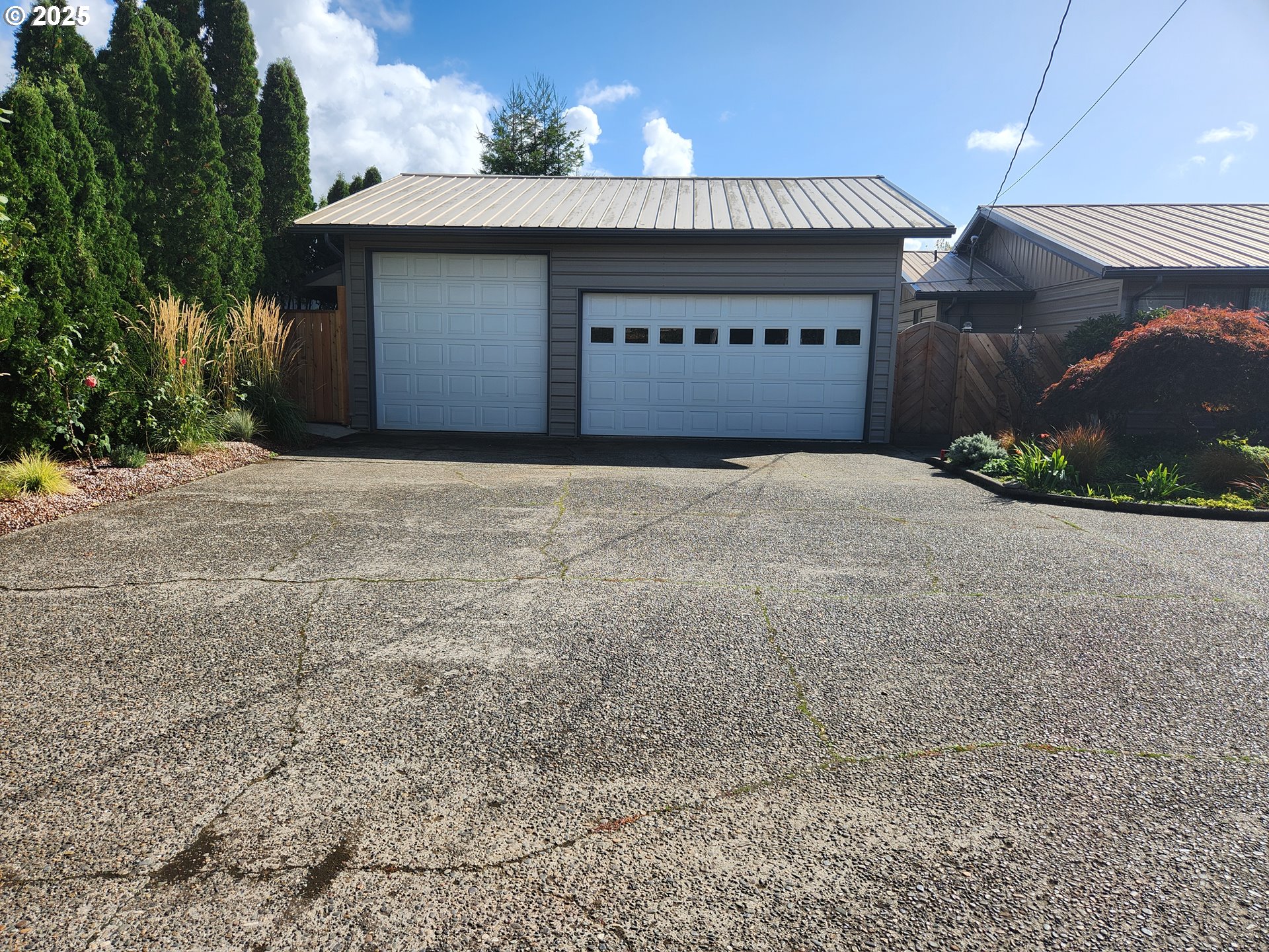 1144 Winchester Avenue Reedsport, OR 97467 - Photo 40 of 47 a front view of a house with a yard and garage