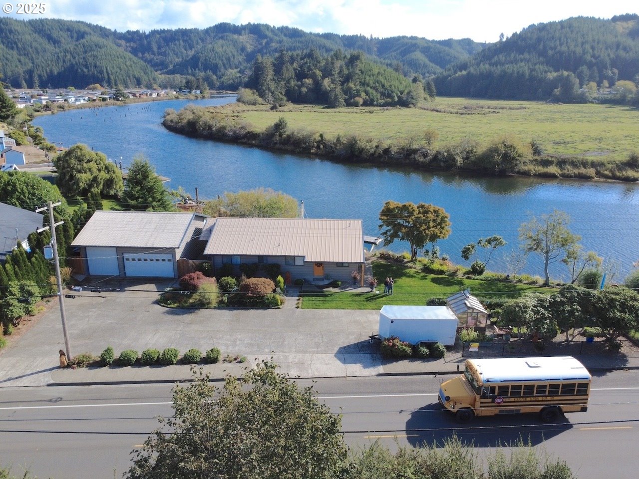 1144 Winchester Avenue Reedsport, OR 97467 - Photo 46 of 47 an aerial view of a house with pool lake view and mountain view