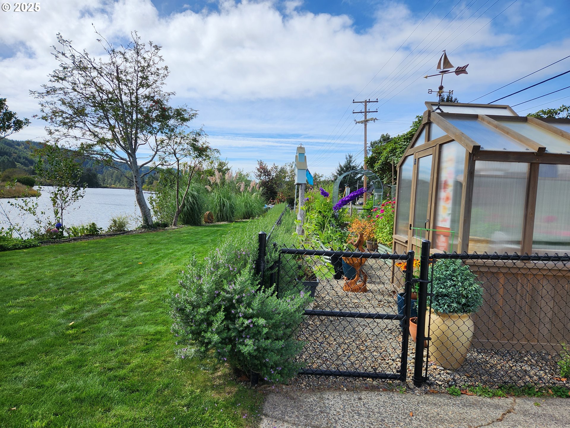 1144 Winchester Avenue Reedsport, OR 97467 - Photo 5 of 47 a view of a house with a outdoor space