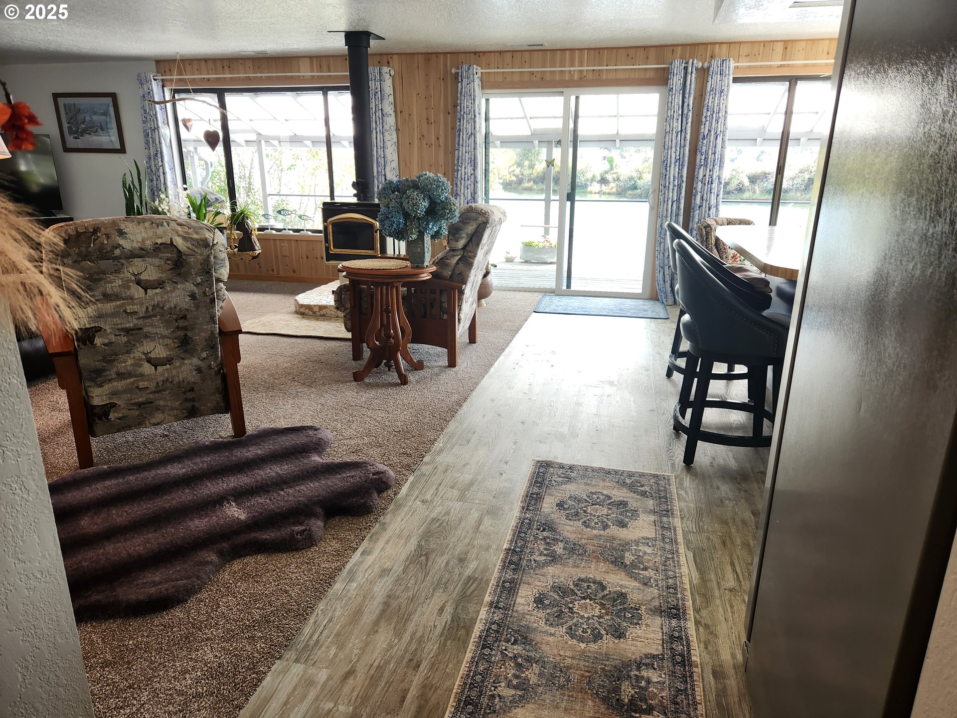1144 Winchester Avenue Reedsport, OR 97467 - Photo 9 of 47 a living room with furniture and a large window