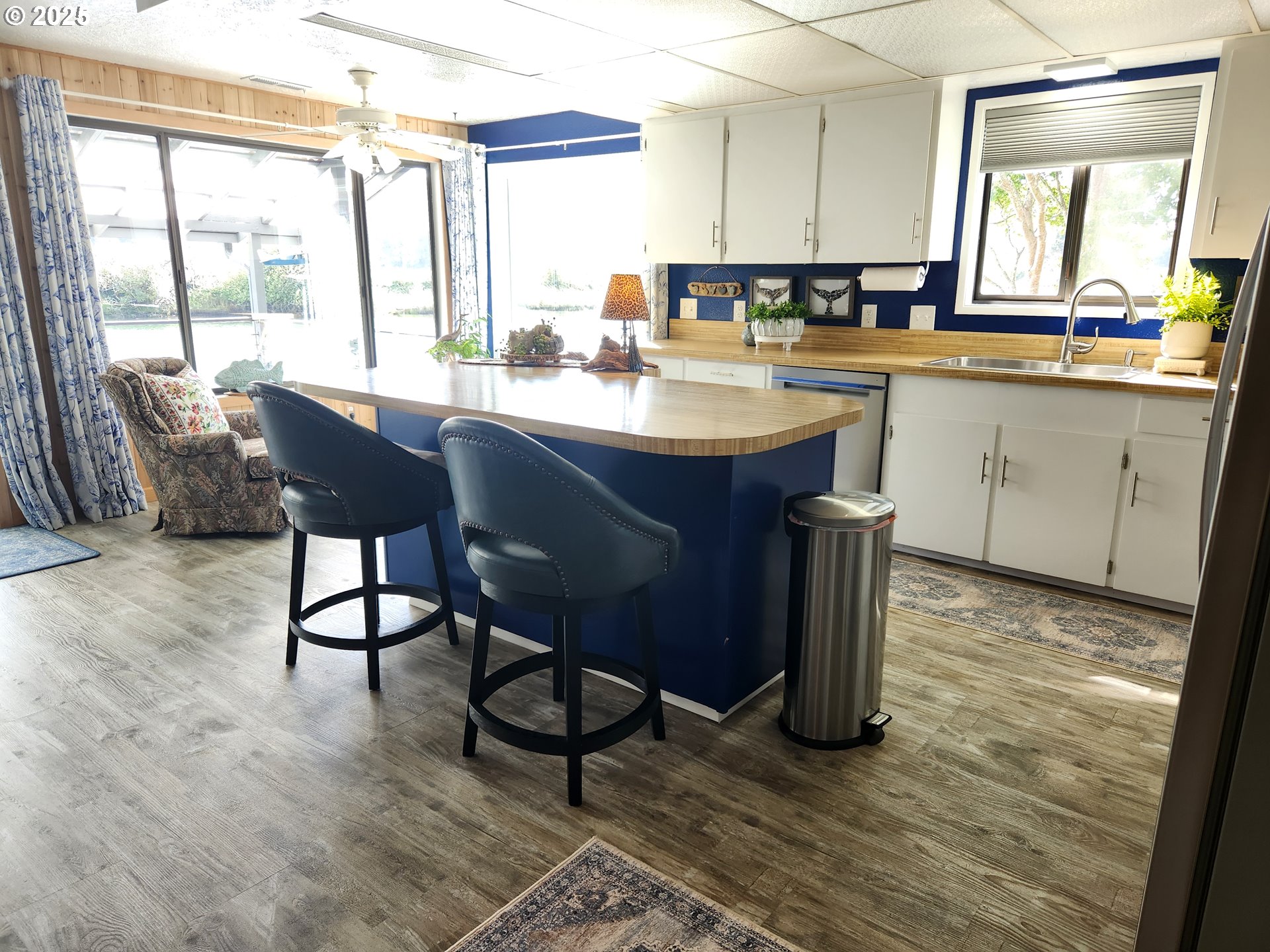 1144 Winchester Avenue Reedsport, OR 97467 - Photo 10 of 47 a kitchen with a sink cabinets and wooden floor