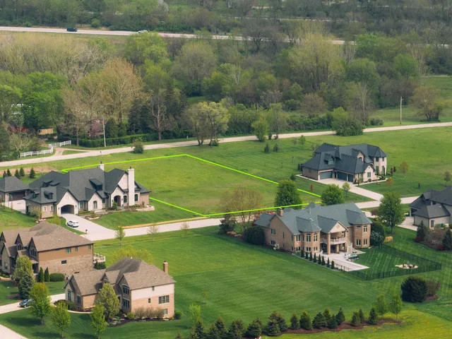 a view of a table and chairs in the garden