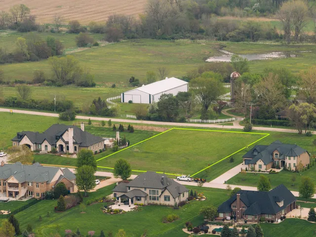 a view of a lake with a yard