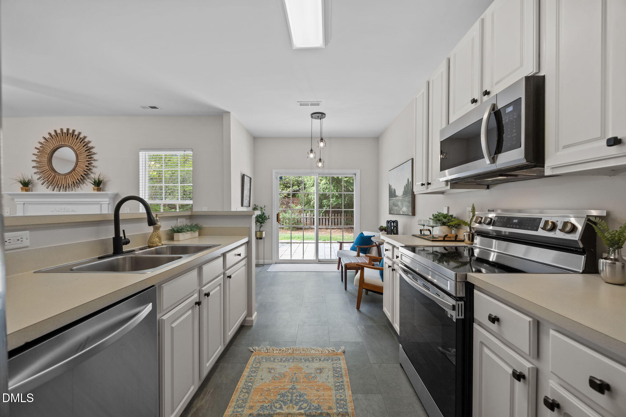 1003 Red Hat Lane Durham, NC 27713 - Photo 26 of 60 a kitchen with stainless steel appliances granite countertop a sink and stove
