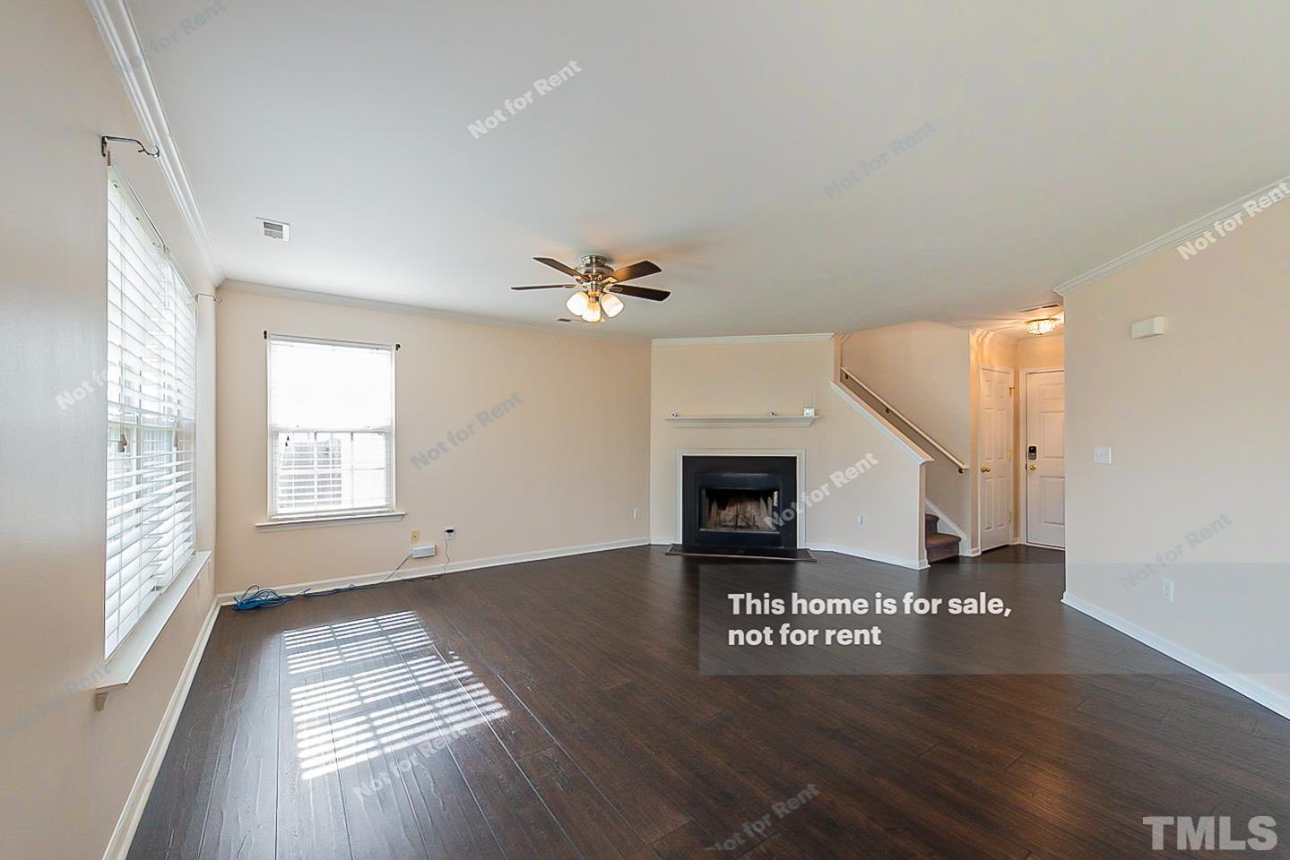 7405 Lowell Ridge Road Raleigh, NC 27616 - Photo 3 of 16 a view of an empty room window and wooden floor