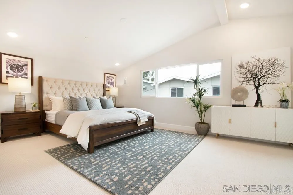 348 Walnut Avenue Carlsbad, CA 92008 - Photo 12 of 20 a bedroom with a large bed and a couch