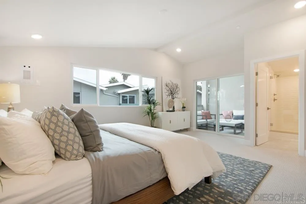 348 Walnut Avenue Carlsbad, CA 92008 - Photo 15 of 20 a large bedroom with a bed and window