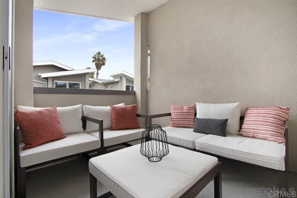 348 Walnut Avenue Carlsbad, CA 92008 - Photo 18 of 20 a living room with furniture and a lamp