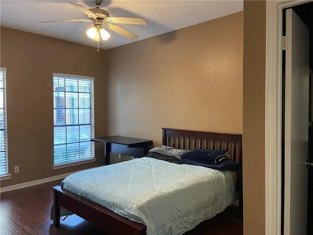 a bathroom with a sink vanity and mirror