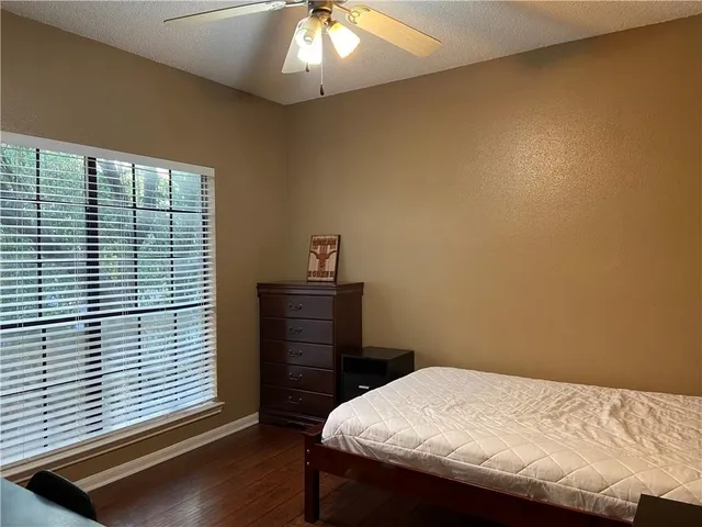 a bathroom with a double vanity sink toilet mirror and bathtub
