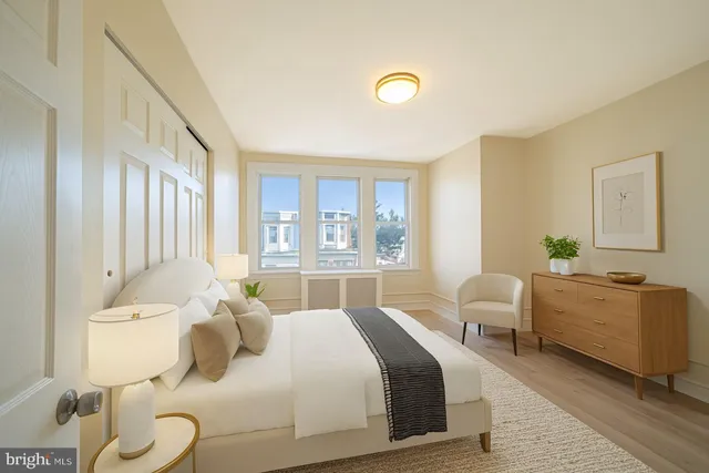 a bedroom with a bed and a couch