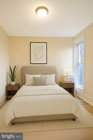 a large white bed in a white room