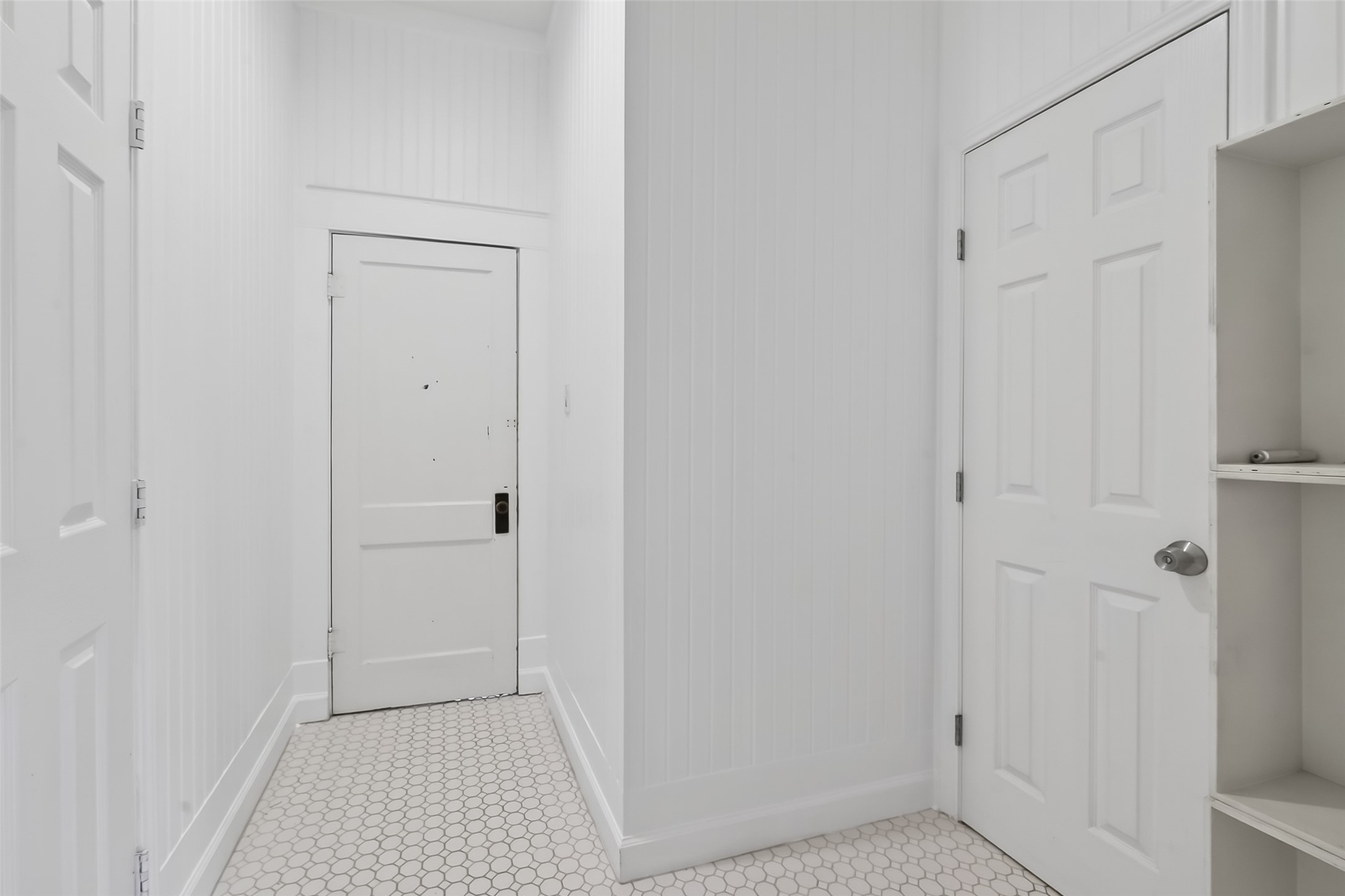 38011 Spur 149 Road Magnolia, TX 77354 - Photo 32 of 50 This hall separates two of the bathrooms and has great potentialhe bathroom space. It’s an exciting opportunity to create a more comfortable, functional space.