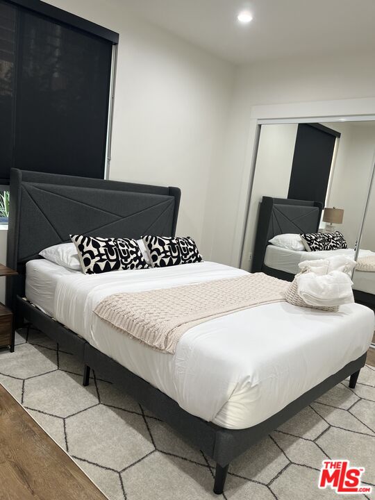 124 South Croft Avenue, Unit 101 Los Angeles, CA 90048 - Photo 16 of 22 a large white bed in a white room